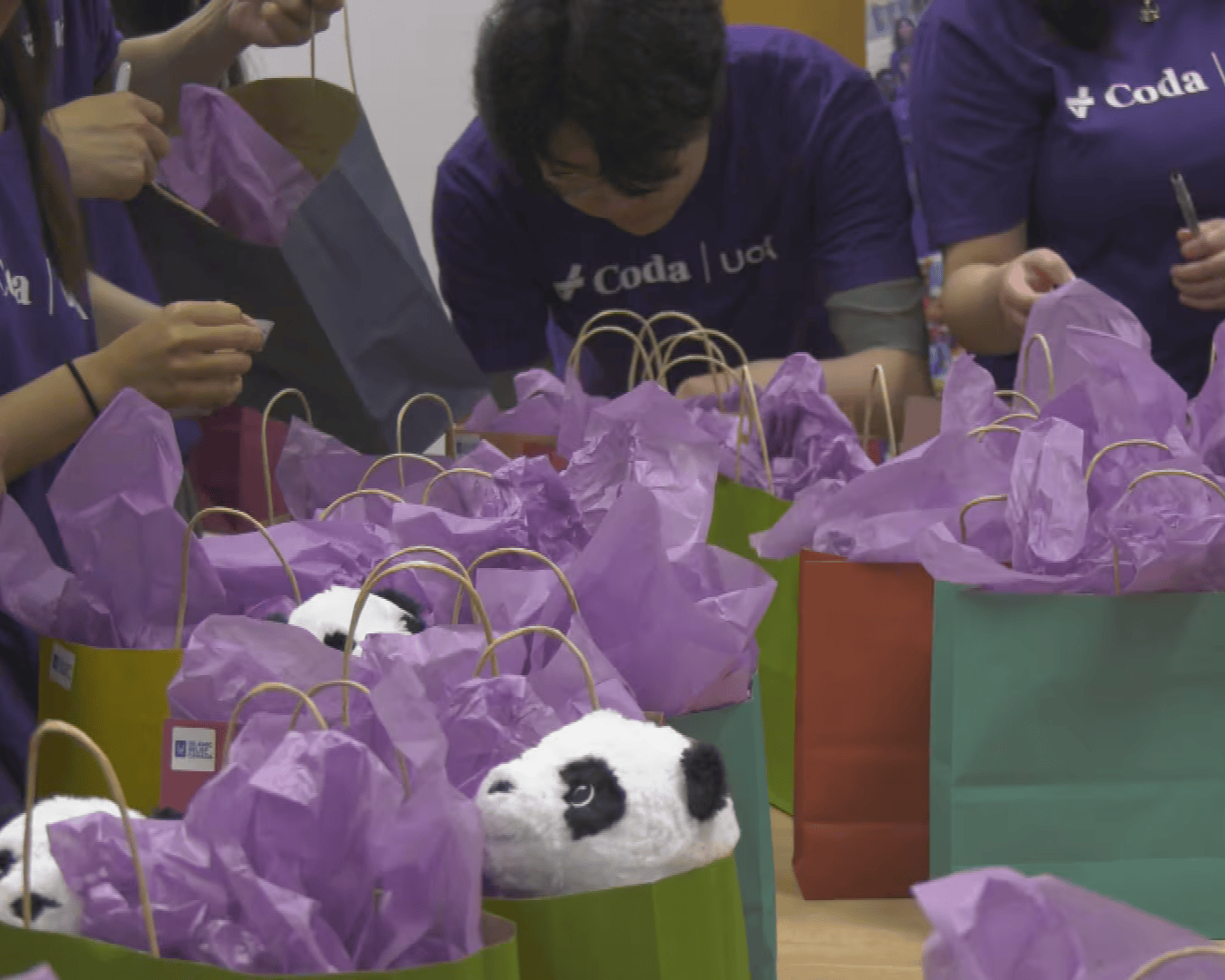 Our UofA team packaging gifts for hospitalized children during our 2026 Halfway to the Holidays event