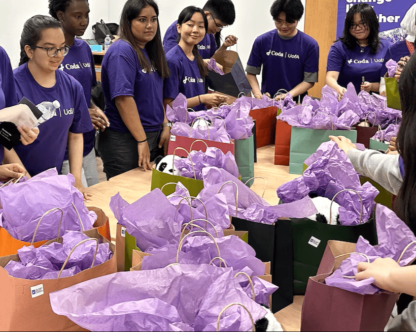 Our UofA team packaging gifts for hospitalized children during our 2026 Halfway to the Holidays event